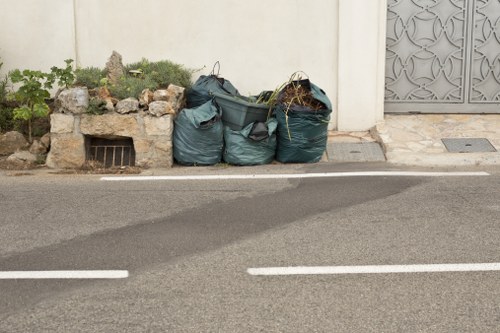 Workers managing construction waste on-site in Barbican
